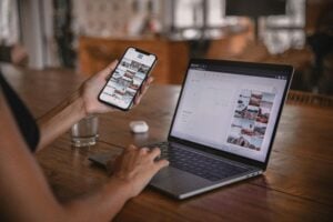 image of homeowner researching home services business on a laptop and mobile